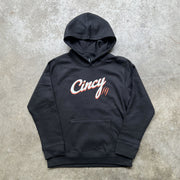 Front view of black youth Cincy hoodie with white and orange printed logo and orange claw-mark accents