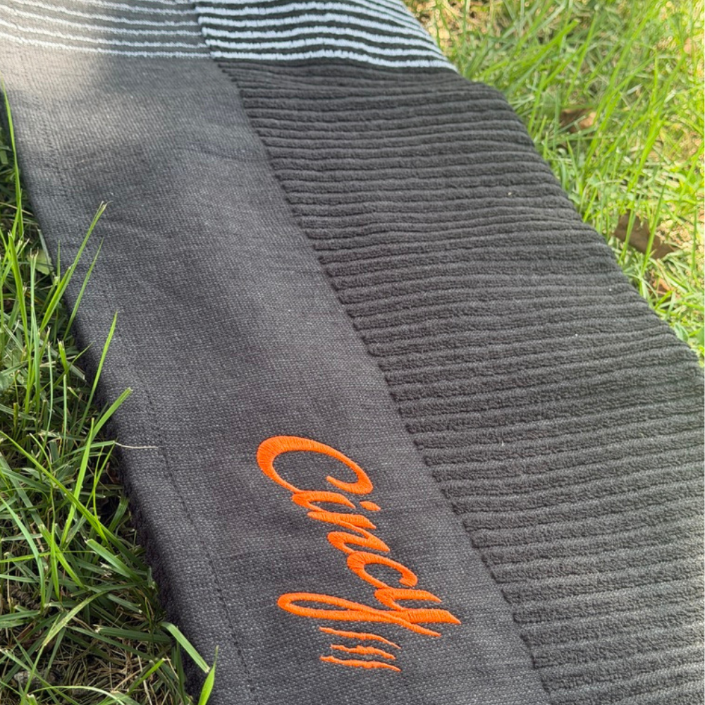 The Cincy Golf Towel - Winston Collection - Black, close-up of embroidered Cincy script