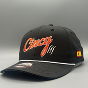Black mid-crown rope hat with orange Cincy embroidery, white rope, and Spanish flag side patch, front view