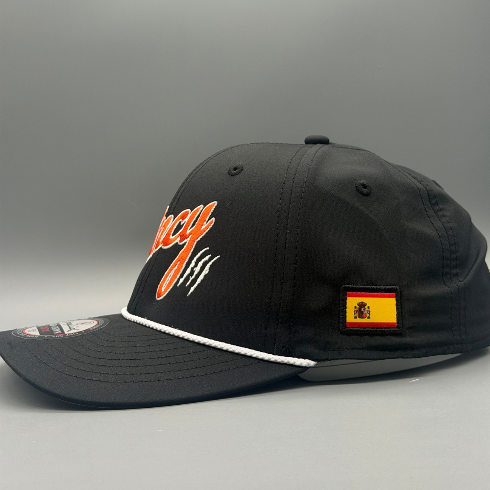 Side view of black Cincy rope hat showing the Spanish flag patch and white rope across the brim