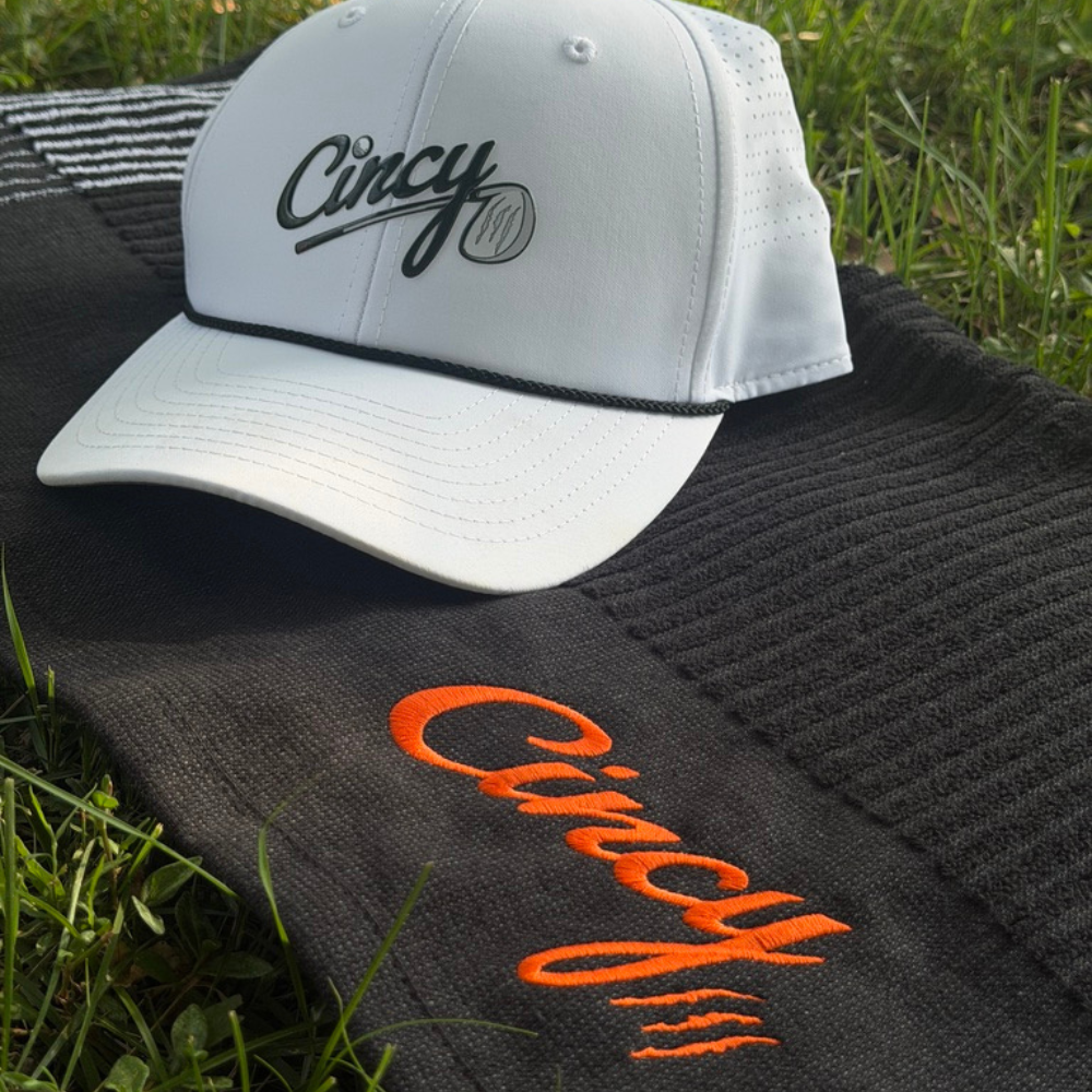 The Cincy Golf Towel - Winston Collection - Black, styled with Cincy Hat
