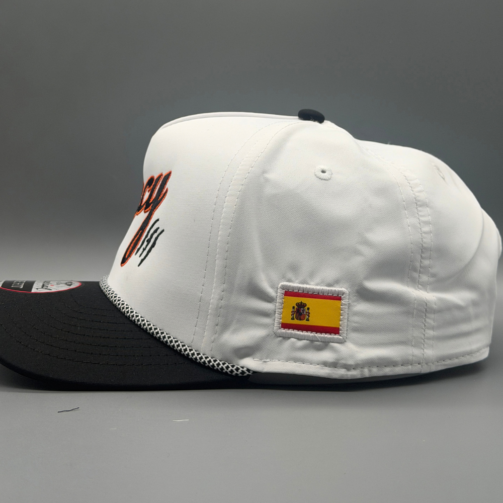 Side view of white and black OG 5 Panel rope hat showing the embroidered Spanish flag patch